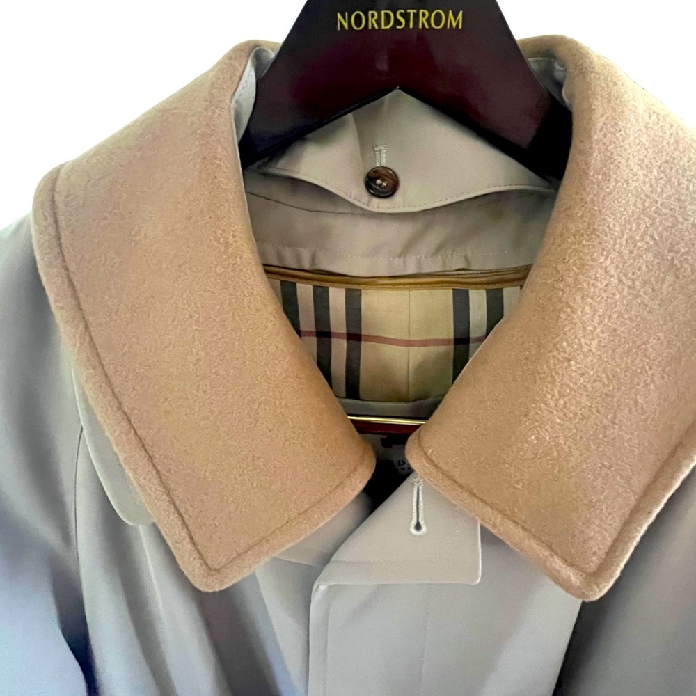 NEW Burberry men’s trench coat. Never worn, kept in zippered bag, no tags.